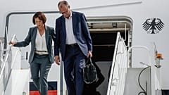 German Chancellor Friedrich Merz, right, and his wife Charlotte Merz arrive in Calgary, Alberta, Sunday, June 15, 2025, to attend the G7 Leaders