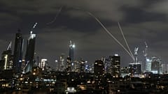 The Israeli Iron Dome air defence system fires to intercept missiles over Tel Aviv, 15 June 2025