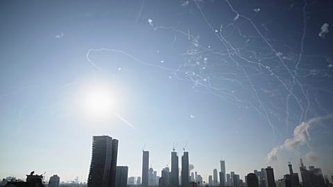 Israeli air defense system fires to intercept missiles during an Iranian attack over Tel Aviv, Israel, Thursday, June 19, 2025