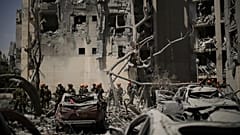 Israeli soldiers from the Home Front Command unit work at the site struck by an Iranian missile strike that killed several people, in Beersheba, Israel, on Tuesday, June 24.