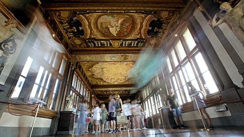 Visitors walk the Uffizi Galleries, in Florence, Italy, Tuesday, Aug. 6, 2019