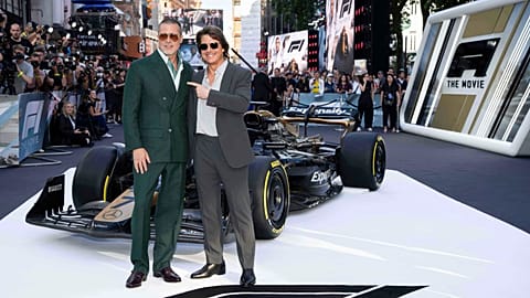 Brad Pitt, left, and Tom Cruise pose for photographers upon arrival at the EU premiere of the film 'F1 The Movie'  in London. 