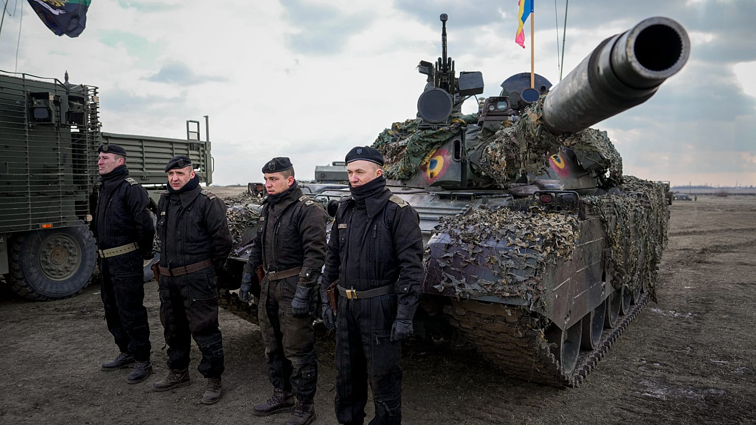 FILE: Romanian servicemen sit in front of a tank at the end of the Steadfast Dart 2025 exercise, in Smardan, 19 February 2025