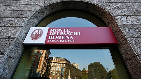 In this Sunday, Oct. 26, 2014, file photo, a branch of the Monte dei Paschi di Siena bank in Milan is seen.