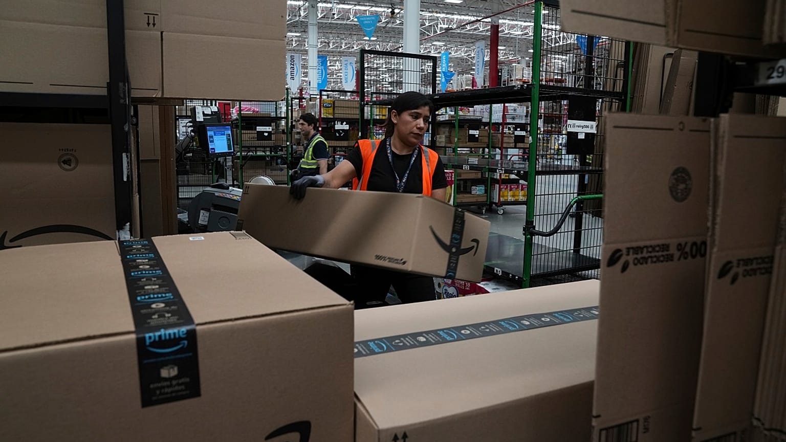 An Amazon employee working in a warehouse. 