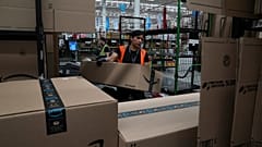 An Amazon employee working in a warehouse. 