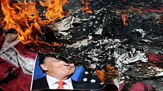 A poster of US President Donald Trump is set on fire during the annual anti-Israeli Jerusalem Day rally in Tehran, 8 June, 2018 