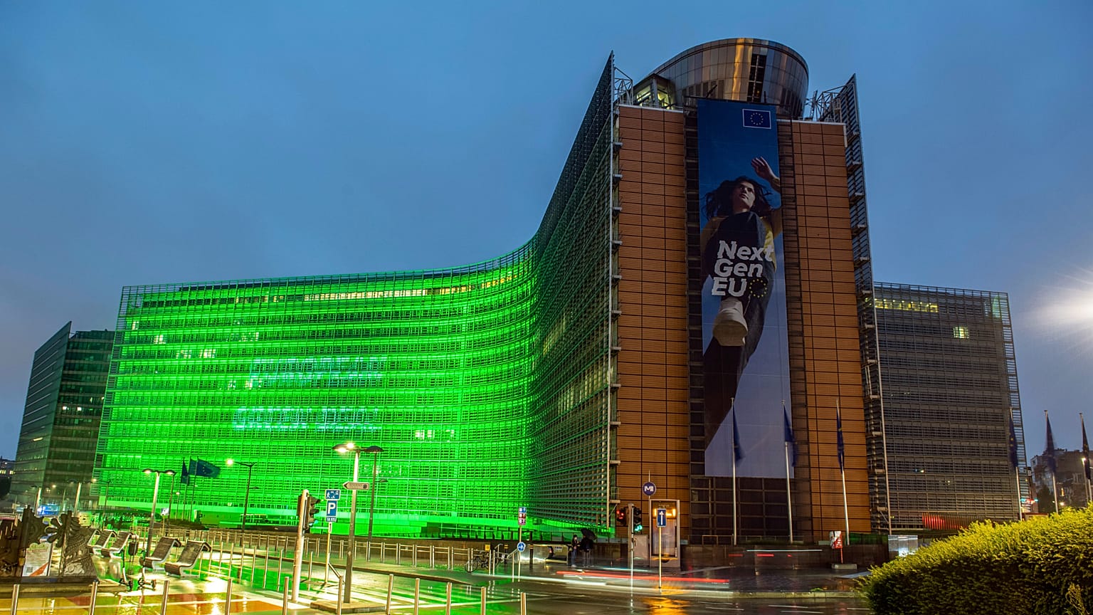 The European Commission building lit up in green for the European Green Pact