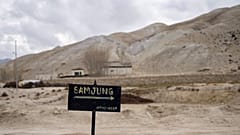 A signboard points the way to the newly relocated settlement of the abandoned Samjung village in the Mustang region.