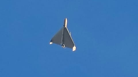 An Iranian Shahed exploding drone launched by Russia flies through the sky seconds before it struck buildings in Kyiv, 17 October, 2022