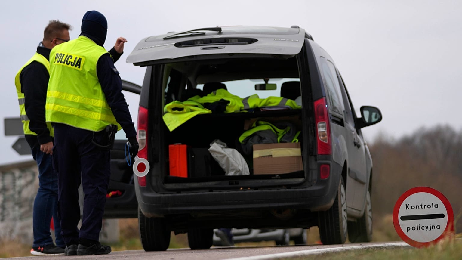 FILE: Polish police officers patrol vehicles, near the Polish-Belarusian border, 15 November 2021