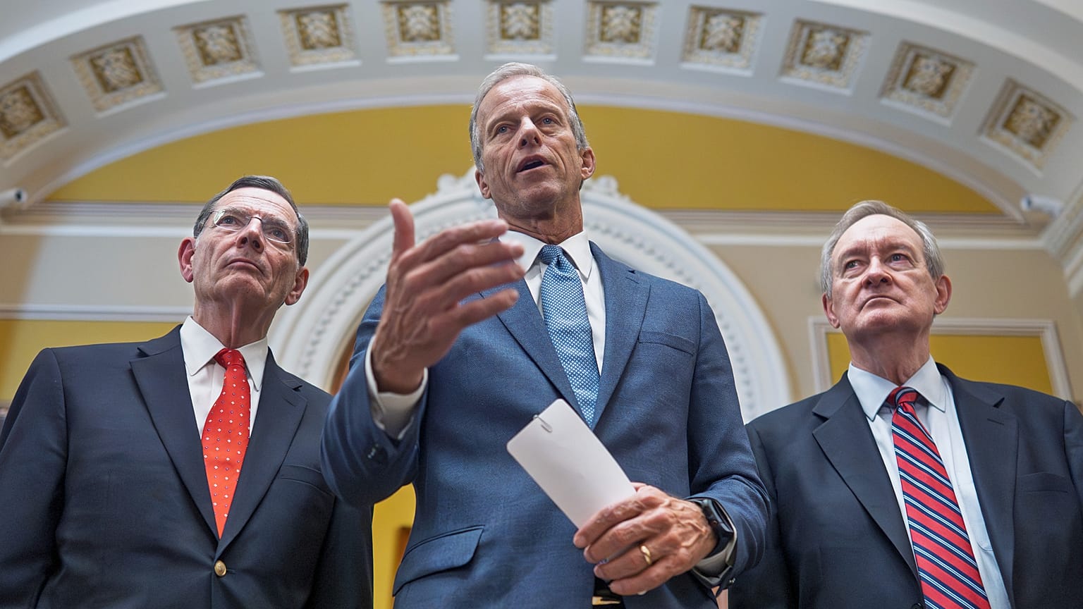 Senate Majority Leader John Thune, centre, speaks to reporters just after passage of the budget package in Washington, 1 July, 2025