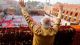 Indian Prime Minister Narendra Modi, waves during the inauguration of Kashi Vishwanath Dham Corridor,