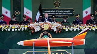 Iranian President Masoud Pezeshkian reviews military hardware at the army parade commemorating National Army Day near Tehran, 18 April 2025