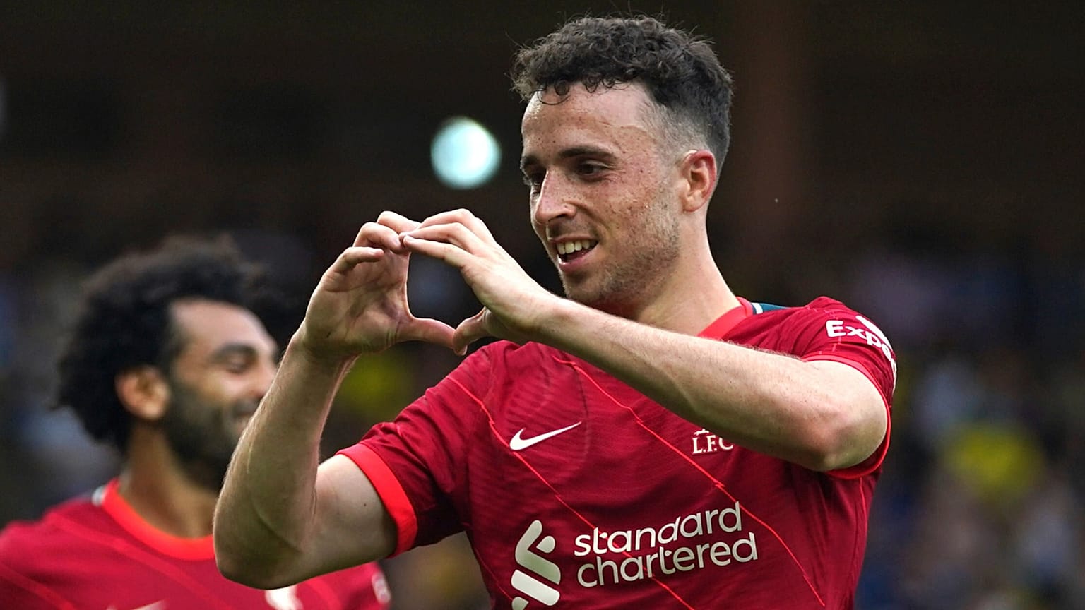 FILE - Liverpool's Diogo Jota celebrates scoring during the Premier League match at Carrow Road, Norwich, 14 August 2021
