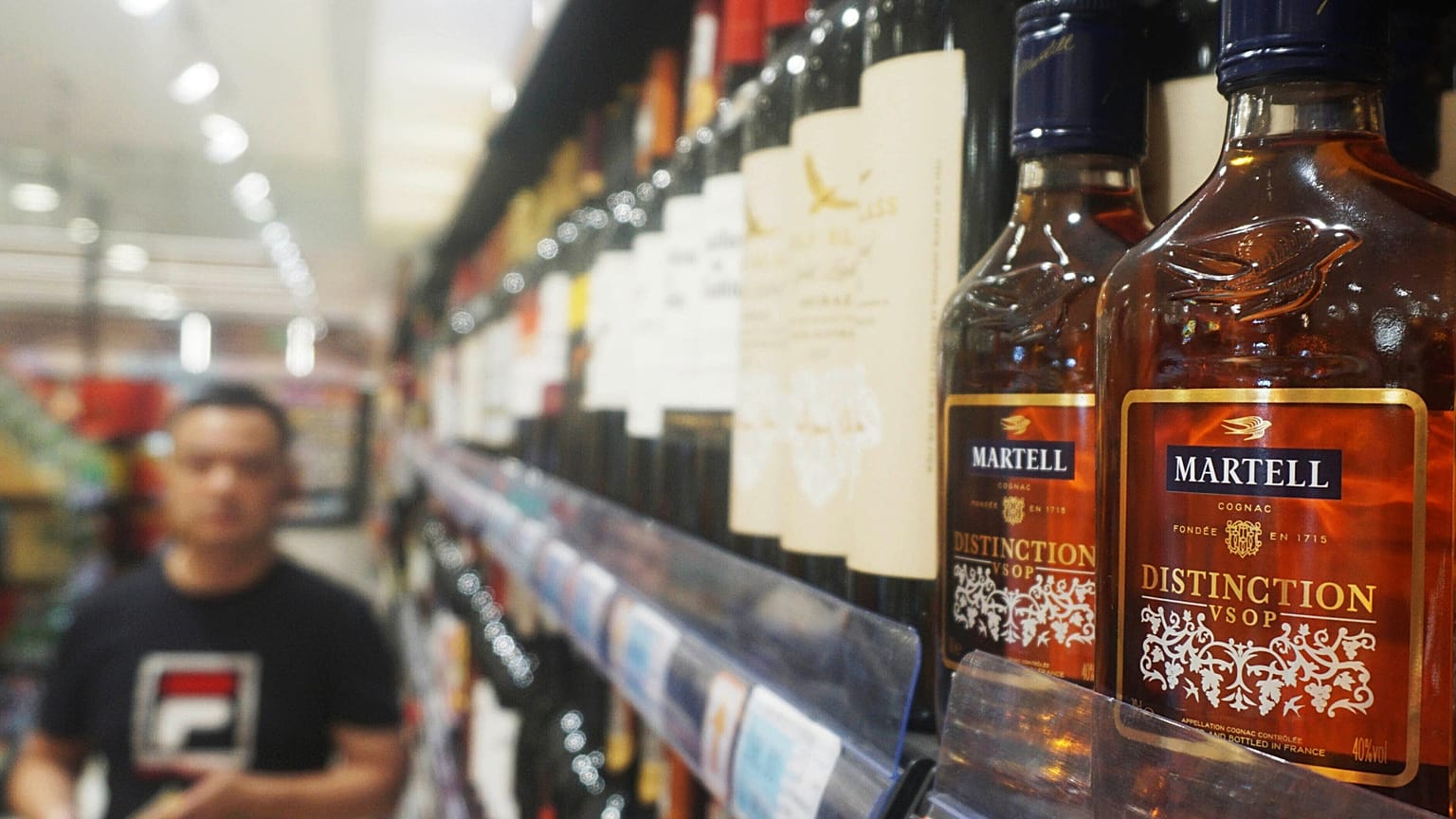 Bottles of brandy are seen on a shelf at a supermarket in Hangzhou in eastern China's Zhejiang province, 8 October, 2024