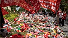 Football fans leave tributes in memory of Liverpool player Diogo Jota at Anfield Stadium, 4 July, 2025