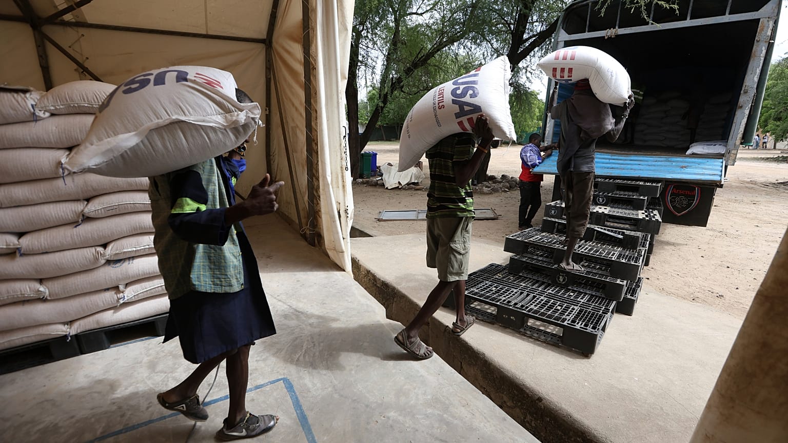 Workers load USAID humanitarian aid into a truck at a World Food Programme warehouse in Kakuma Refugee Camp in Kenya, 3 June, 2025