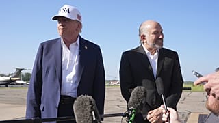 President Donald Trump listens as Commerce Secretary Howard Lutnick speaks with reporters. Morristown Municipal Airport, New Jersey. 6 July 2025.