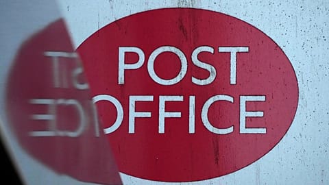 FILE: A post office logo on a shop front on a street in London, Tuesday, Jan. 16, 2024. 