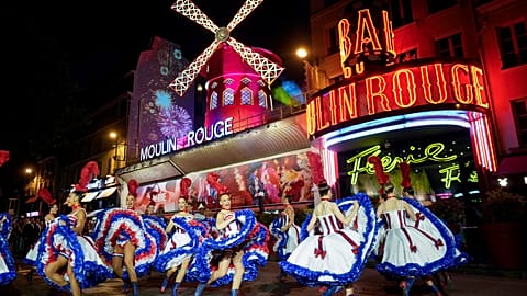 Dancers perform during the inauguration of the Moulin Rouge's windmill in Paris, 5 July 2024
