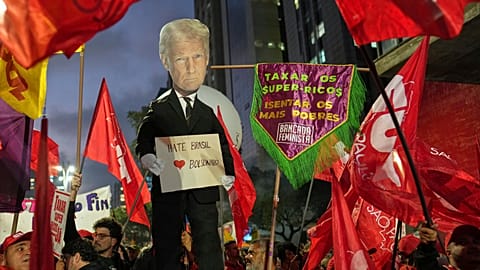 Protesters hold up an effigy of U.S. President Donald Trump in response to Trump's announcement of 50% tariffs on Brazilian goods, in Sao Paulo, Thursday, July 10, 2025.