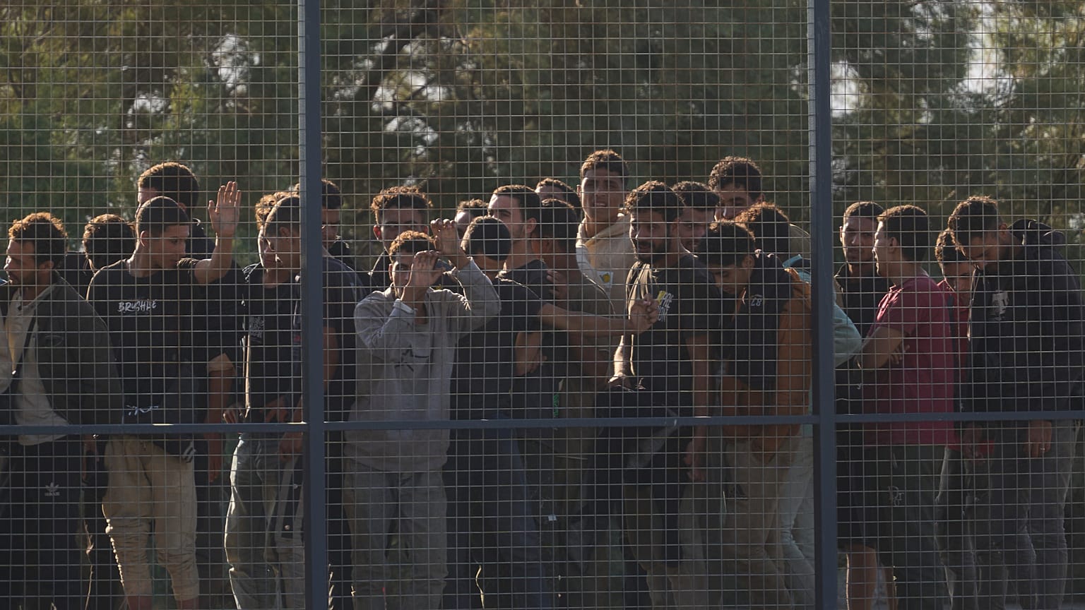Migrants rescued south of Crete wait to be registered on their arrival at the the port of Lavrio, 10 July, 2025 