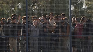 Migrants rescued south of Crete wait to be registered on their arrival at the the port of Lavrio, 10 July, 2025