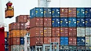 FILE. A container is loaded onto a cargo ship at the Tianjin port in China, Aug. 2010