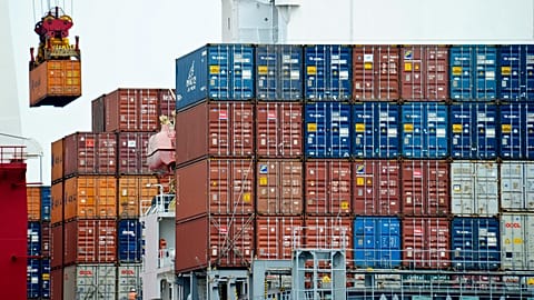 n this Aug. 5, 2010, file photo, a container is loaded onto a cargo ship at the Tianjin port in China. 