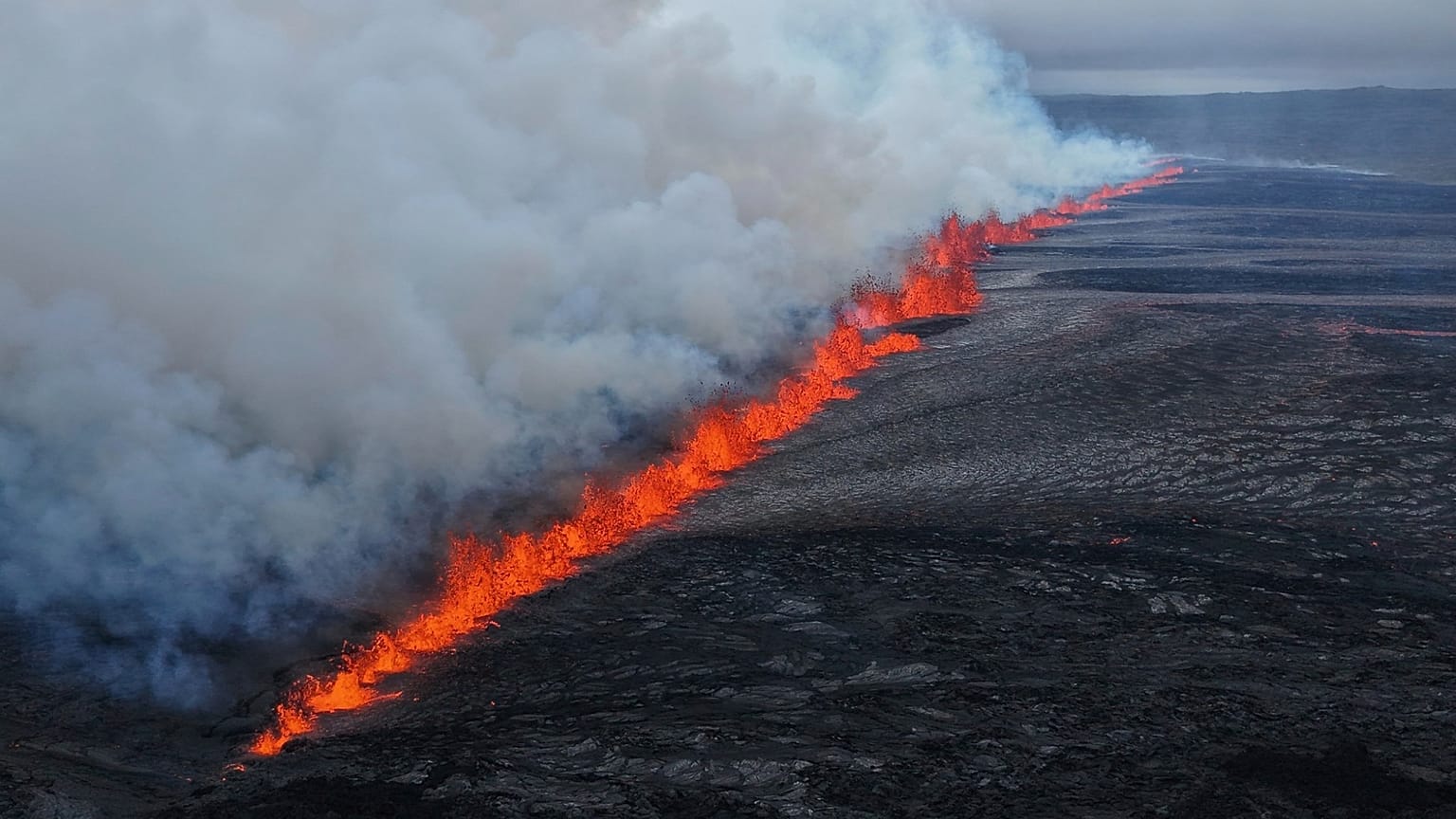 A view of the volcanic eruption by the Sundhnúkagigjarö íur volcano, in Grindavik, Iceland, Wednesday, 16 July.