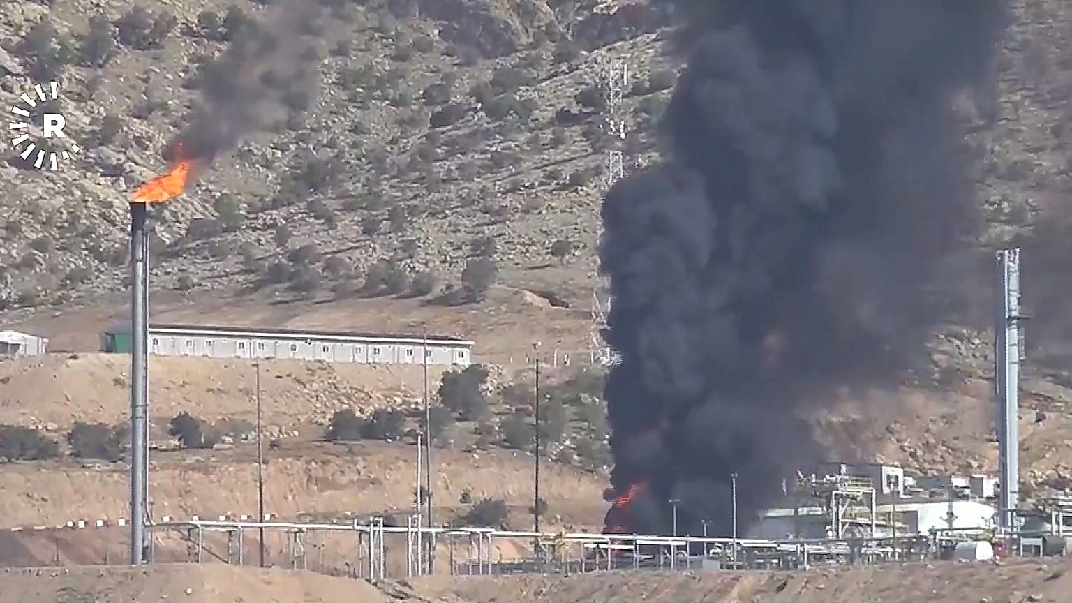 This frame grab from a video released by Rudy TV shows black smoke rises following drone attacks on an oil field in the Zakho district, 16 July, 2025