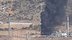This frame grab from a video released by Rudy TV shows black smoke rises following drone attacks on an oil field in the Zakho district, 16 July, 2025