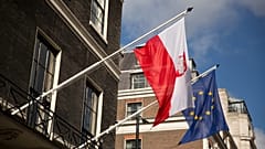 FILE: A Polish and EU flag fly outside the Polish Embassy in London, 27 October 2016