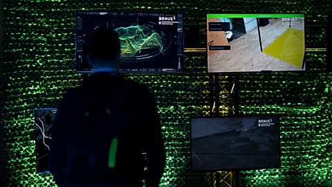 An observer looks over an exhibition featuring some of the Ukrainian technologies being used on the battlefield as a part of a presentation of the BRAVE1 initiative