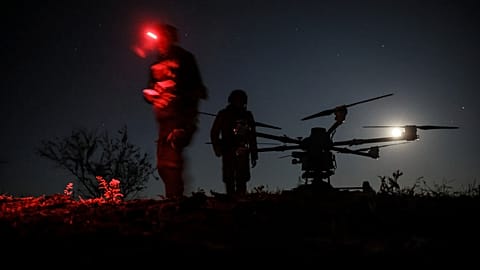 Servicemen prepare the drone "Kazhan" that delivers supply and carry heavy bombs on the front line near Chasiv Yar, 15 May, 2025