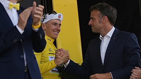 French President Emmanuel Macron congratulates Slovenia's Tadej Pogacar, after the twelfth stage of the Tour de France cycling race. France, Thursday, July 17, 2025. 