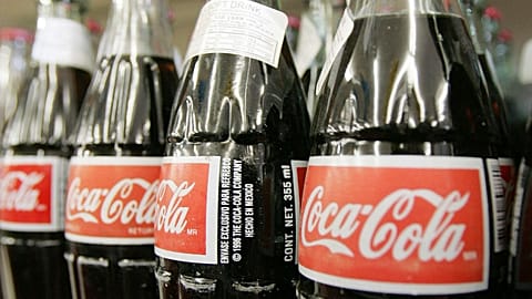 Bottles of Mexican Coca-Cola fill a prominent spot on the shelves of the Tarascas Latino Supermarket in Lawrenceville, Ga., Nov. 3, 2004. 