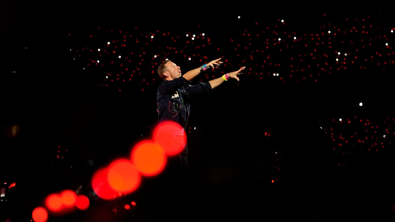 Chris Martin of Coldplay performs during the band's Music Of The Spheres World Tour at D. Y. Patil Sports Stadium in Navi Mumbai, Saturday, Jan. 18, 2025.