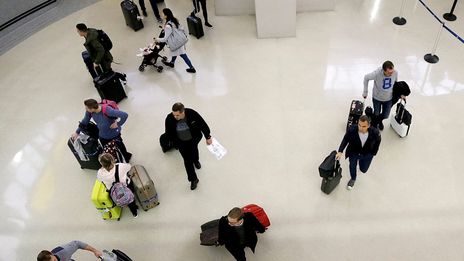 Passengers arriving at arrivals terminal