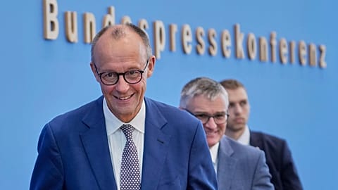 German Chancellor Friedrich Merz leaves after the annual press conference at the Federal Press Conference in Berlin, Germany, Friday, July 18, 2025.