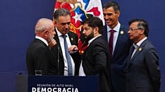 Latin American leaders and Spain's Prime Minister Pedro Sanchez talk during a forum on democracy and multilateralism at La Moneda palace in Santiago, 21 July 2025
