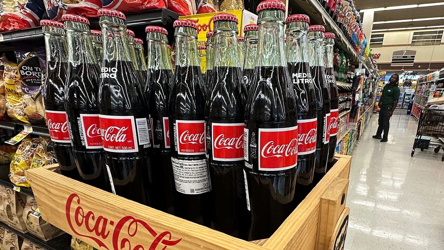 Bottles of Coca-Cola are seen at a supermarket in the US in 2022.