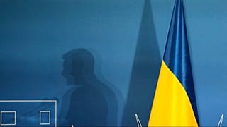 FILE: The shadow of Ukraine's President Volodymyr Zelenskyy is projected on a wall at La Nuvola convention center in Rome, Thursday, July 10, 2025.