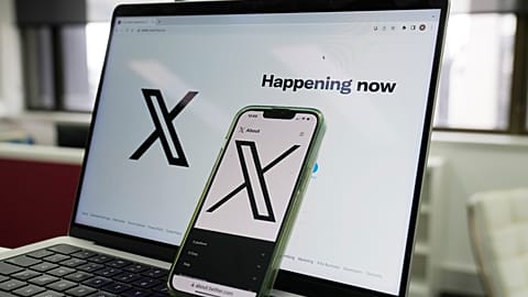 FILE - The opening page of X is displayed on a computer and phone, Oct. 16, 2023, in Sydney. 