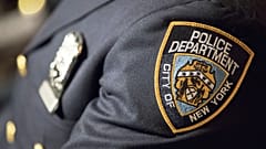 FILE: A badge of the New York City police is seen in New York, 29 June 2017