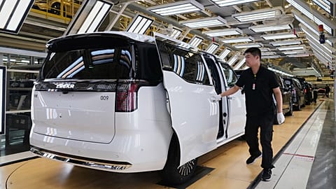 A worker gives a final check on Zeekr EV models at the Chinese automaker Zeekr assembly plant, in Ningbo, east China's Zhejiang Province on April 16, 2025 (AP Photo/Andy Wong)
