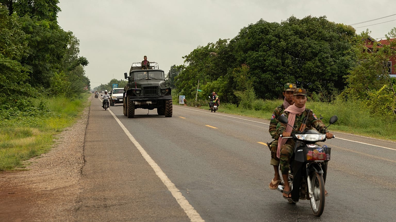 A Cambodian military convoy drives towards the border city of Samrong in Oddar Meanchey Province, 26 July 2025