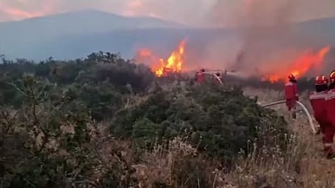 Firefighters battle the flames in Albania