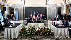 Malaysia's PM Anwar Ibrahim looks on as Cambodia's Hun Manet and Thailand's Phumtham Wechayachai take part in talks on a possible ceasefire, in Putrajaya, 28 July 2025